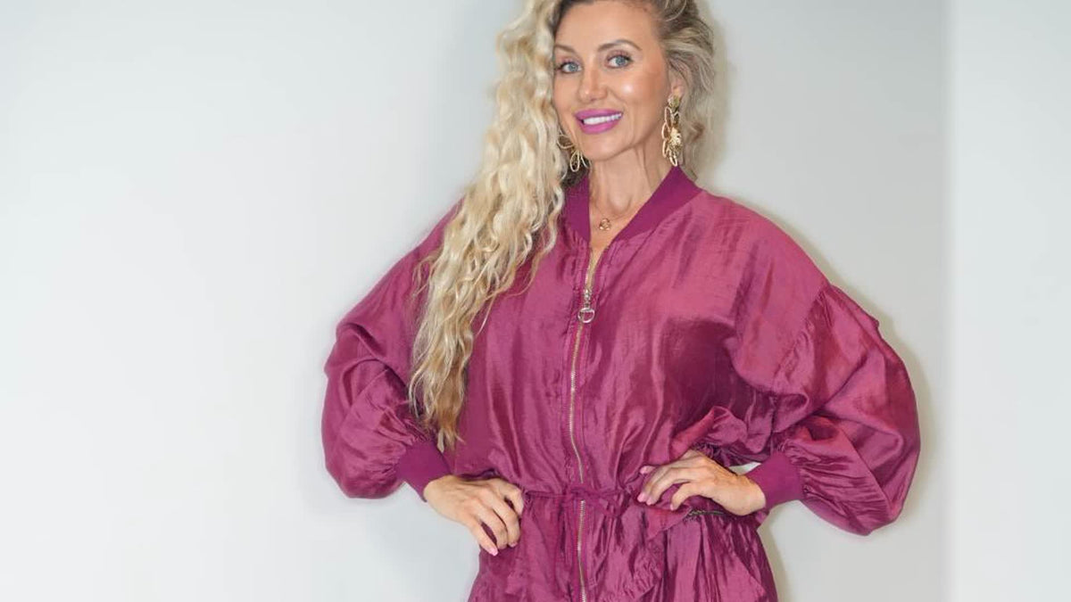 Viktoria wearing the magenta satin jumpsuit