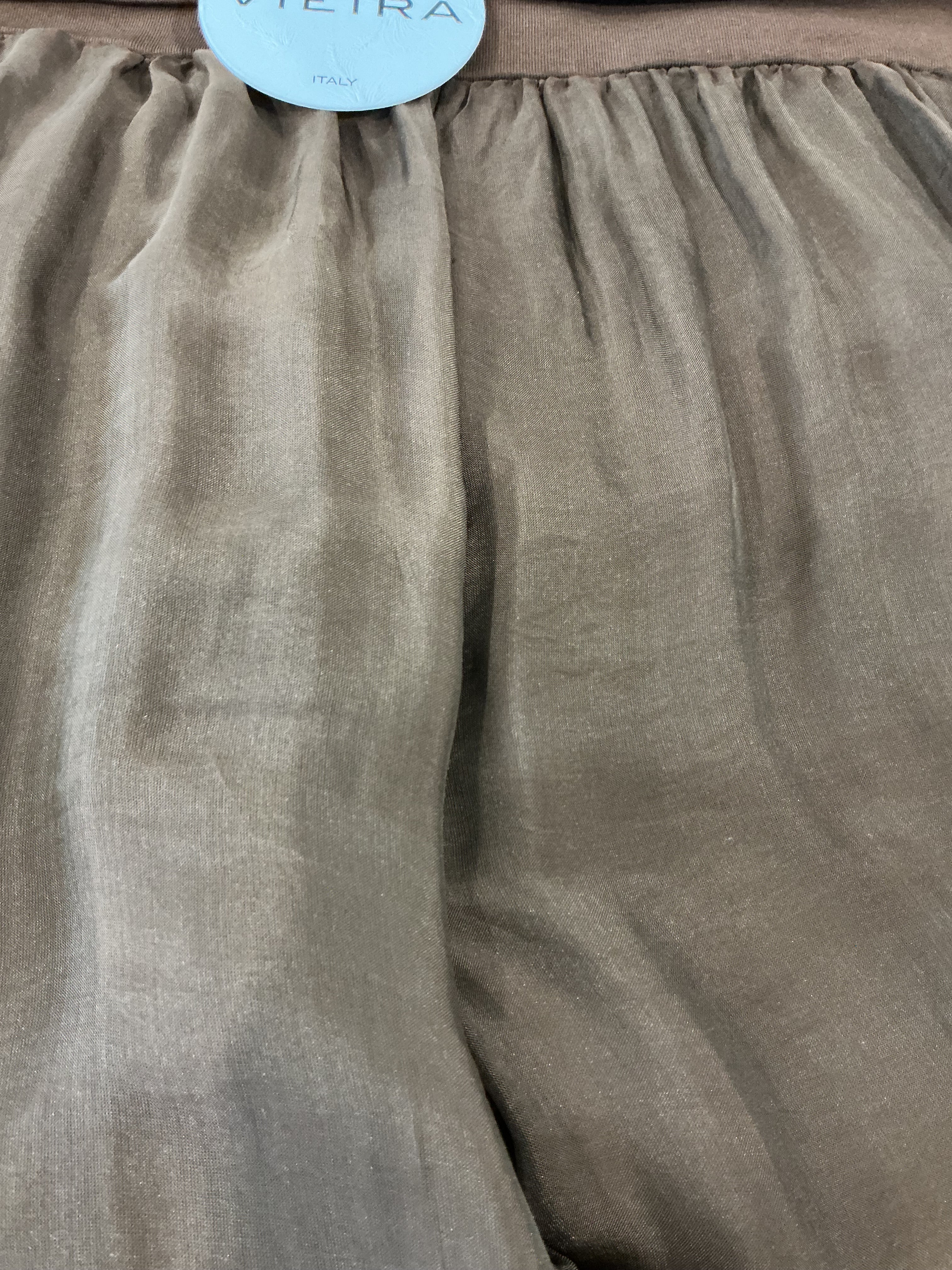 Close-up of a textured fabric with a visible brand label.